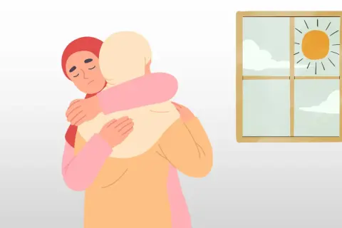 Två personer kramas. Den ena med sluten blick, kanske ett tecken på klinisk depression, får stöd. Utanför fönstret skiner solen.
