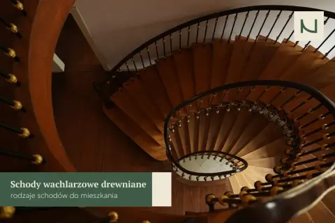 Eleganckie schody wachlarzowe z drewna, z czarną balustradą i złotymi zdobieniami, tworzą stylowe wnętrze.