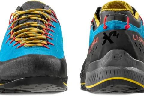 Buty La Sportiva TX4 Evo w kolorze niebieskim z żółtymi sznurówkami i czerwonymi akcentami. Idealne na górskie wyprawy.