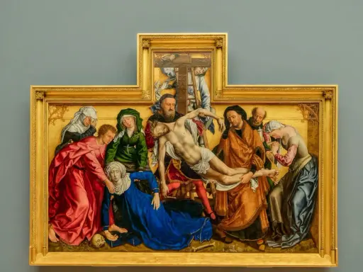 A dramatic religious painting, likely from a museum, depicts the descent from the cross with figures in rich robes surrounding a fallen Christ.