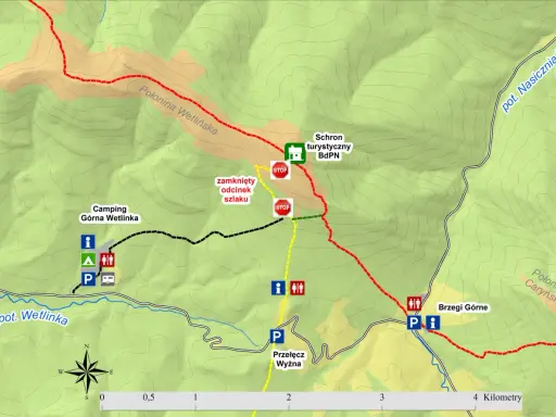 Mapa turystyczna z zaznaczonymi szlakami, schroniskiem BdPN, campingiem Górna Wetlinka i informacją o zamkniętym odcinku szlaku na Połoninie Wetlińskiej.