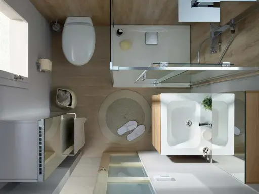 Aménagement petite salle de bain : vue de dessus d'une douche, lavabo, WC et meuble de rangement.