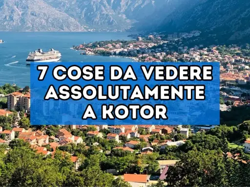 Panoramica del centro storico di Kotor, con un grande transatlantico nel golfo e montagne sullo sfondo.