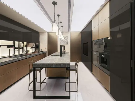 Cucina moderna Valcucine SPA con isola centrale in marmo, pensili neri lucidi e finiture in bronzo.