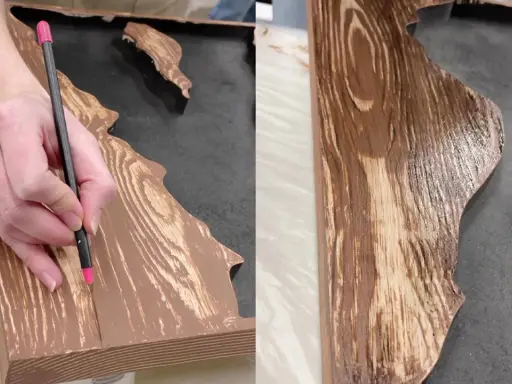 Mano detallando un diseño para pintar efecto madera sobre una superficie.
