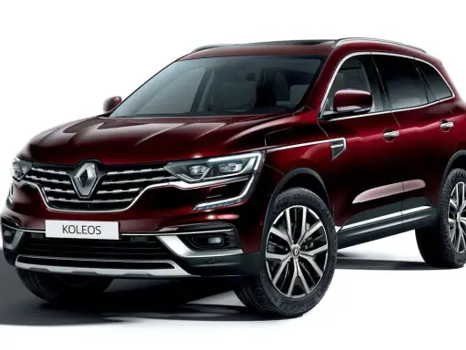 Elegancki, bordowy Renault Koleos 2.0 dCi z chromowanymi detalami i felgami 19 cali, gotowy na każdą podróż.