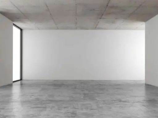 Espacio minimalista con paredes blancas, techo de hormigón y suelo de **cemento pulido** que refleja la luz.