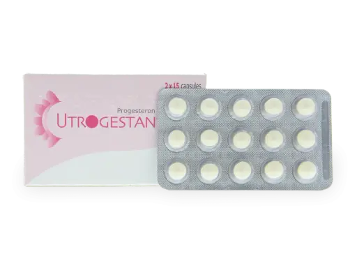 Opakowanie leku Utrogestan z 15 kapsułkami, które mogą być stosowane jako luteina dopochwowa.