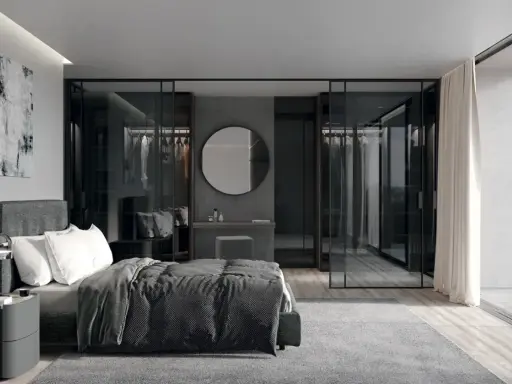 Elegante camera da letto con letto grigio scuro, abbinamenti moderni e cabina armadio a vista.