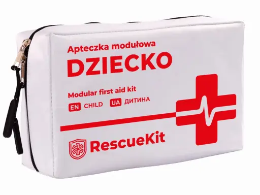 Biała apteczka na wyjazd z dzieckiem, z napisem "DZIECKO" i czerwonym krzyżem ratunkowym. Zapewni bezpieczeństwo podczas każdej podróży.