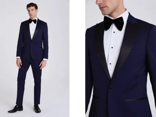 A man models a navy tuxedo with black satin lapels. Inquire about how much are tuxedos rentals for your next formal event.