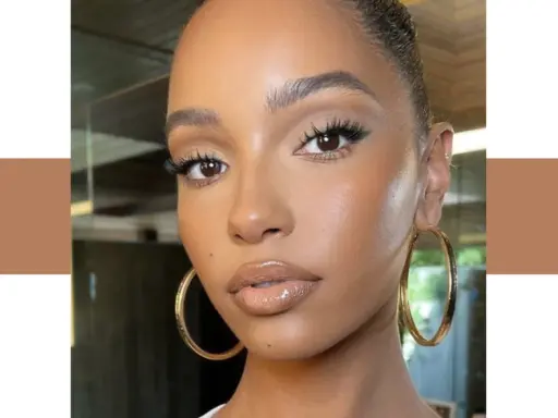 Un teint de peau lumineux et naturel, sublimé par un maquillage subtil et des boucles d'oreilles dorées.