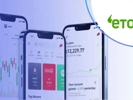 Trzy smartfony pokazują aplikację eToro z wykresami i danymi giełdowymi. Czy eToro jest bezpieczne? Platforma oferuje handel akcjami, kryptowalutami i innymi instrumentami.