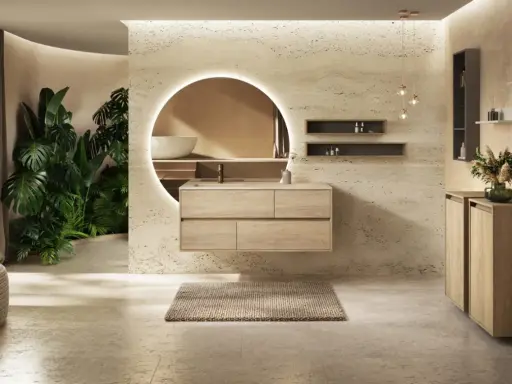 Une salle de bain moderne avec des plantes luxuriantes, un meuble vasque en bois flottant et un miroir rond lumineux. Une belle inspiration salle de bain.