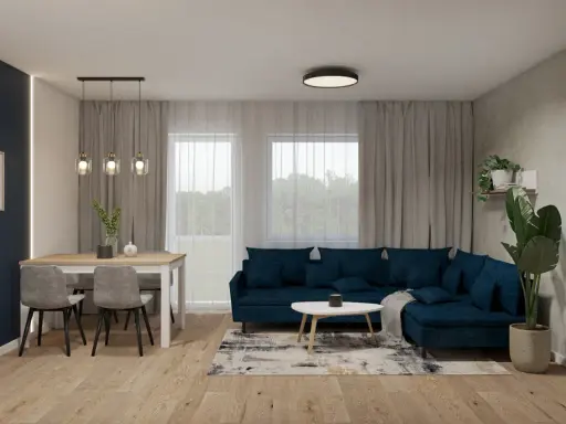 Nowoczesny salon z granatową kanapą i stołem. Dwie lampy wiszące nad stołem i jedna sufitowa tworzą przytulną atmosferę.