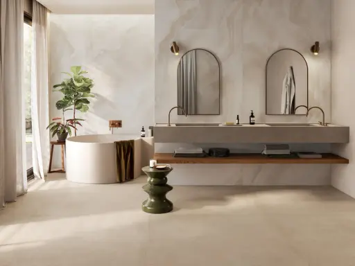 Baño moderno con bañera exenta, lavabos dobles y azulejos a matajunta en paredes y suelo.