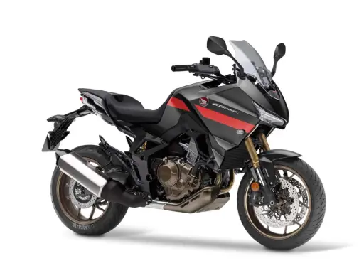 Nowoczesny motocykl Honda NT 1100 w kolorze grafitowym z czerwonymi akcentami, gotowy na dalekie podróże.
