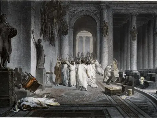 Die Ermordung Caesars: Senatoren mit erhobenen Dolchen umringen den gefallenen Diktator. Ein umgestürzter Stuhl und eine Leiche auf dem Boden zeugen vom brutalen Ende.