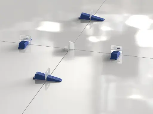 Sistema de nivelación de baldosas con cuñas azules y separadores blancos. La **matajunta desplazada** asegura una instalación perfecta.
