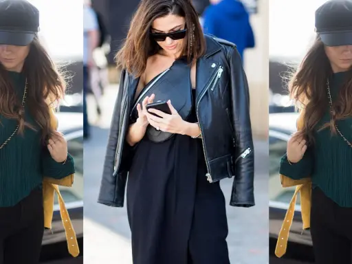 Donna con giacca in pelle, cappello e borsa a tracolla, look casual chic.
