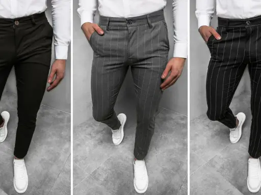 Trzy pary męskich spodni: gładkie ciemne, w pionowe paski szare i czarne. To są chinosy, idealne na co dzień i do eleganckich stylizacji.