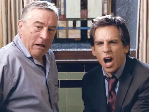 Robert De Niro och Ben Stiller i en komisk scen. Deras ansiktsuttryck antyder en intensiv diskussion, typiskt för filmer med Ben Stiller.