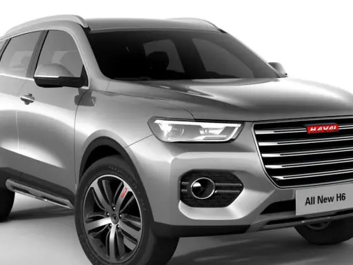 Srebrny SUV Haval H6 z nowoczesnym grillem i światłami LED.