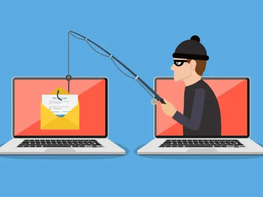 Ein Hacker versucht mit einer Angel, Zugangsdaten von einem Laptop zu stehlen. Ein Symbol für online betrug.