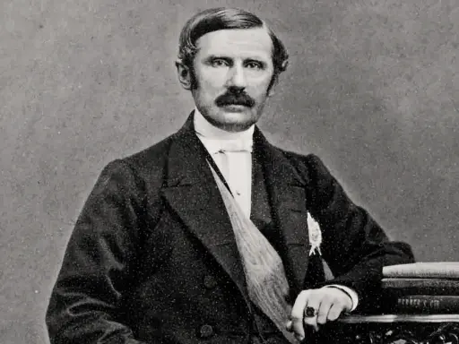Johan August Gripenstedt, en framstående svensk politiker, porträtterad med mustasch och klädd i mörk kostym.