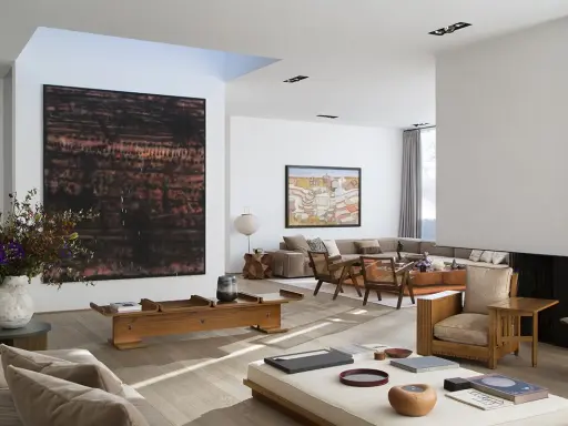 A spacious living room with modern art, including a large abstract piece by tiqui atencio.
