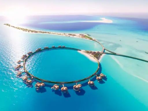 Resort circolare su palafitte nel Mar Rosso Arabia Saudita, con isole sabbiose e acque turchesi.