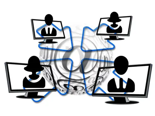 Vier Monitore mit Silhouetten von Personen, verbunden durch blaue Linien, umgeben von einem großen @-Symbol. Dies symbolisiert die Vernetzung und die Bedeutung von Online-Kommunikation, aber auch die Gefahr von "hijacking" – der Übernahme von Accounts.