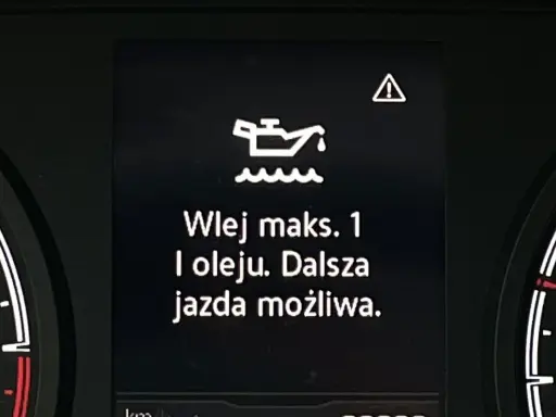 Kontrolka oleju z falą: "Wlej maks. 1 l oleju. Dalsza jazda możliwa." Ostrzeżenie o niskim poziomie oleju.