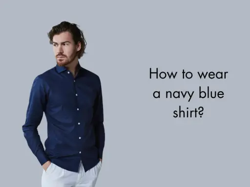 Man in a navy blue shirt and white pants, asking "How to wear a navy blue shirt?".
