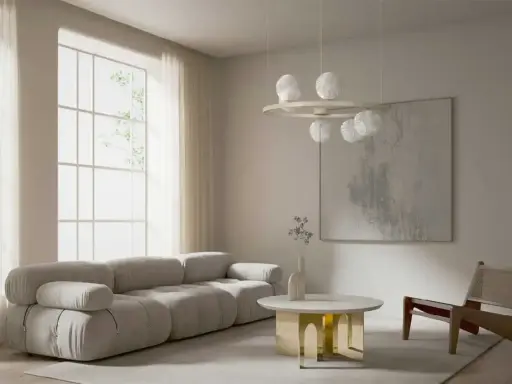 Nowoczesny salon z szarą sofą, okrągłym stolikiem i lampą z kulistymi kloszami w stylu art deco.