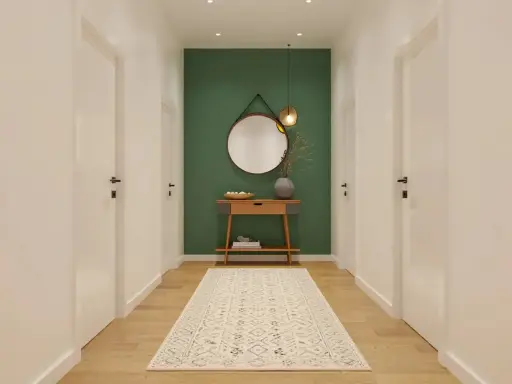 Un couloir moderne avec un mur vert, un miroir rond, une console en bois et un tapis. Une belle idée déco couloir moderne.