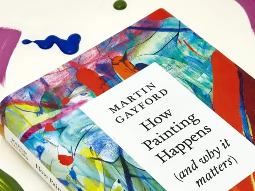 A book titled "How Painting Happens" by Martin Gayford, featuring a vibrant, abstract cover that evokes the spirit of figurative painting. Splatters of paint surround it.