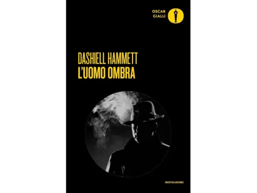 Copertina di "L'uomo ombra" di Dashiell Hammett, un classico dei libri noir. Un investigatore con cappello fuma, immerso nel mistero.
