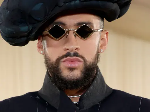 Bad Bunny at the Met Gala, sporting diamond-shaped sunglasses and a dramatic black hat.