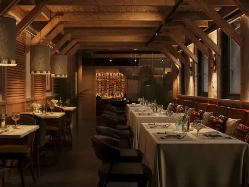 Ambiente acogedor de parrilla argentina nuevos aires. Mesas puestas, vigas de madera y luces cálidas invitan a disfrutar.
