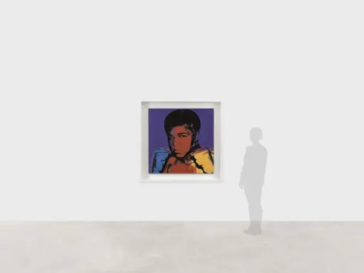 Andy Warhol's iconic portrait of Muhammad Ali, rendered in bold colors, captures the boxer's powerful stance.