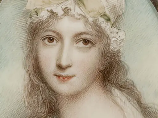 A delicate miniature portrait of a woman in a bonnet, framed by pearls. This tiny artwork captures a moment in time, showcasing the artistry of miniature portraits.