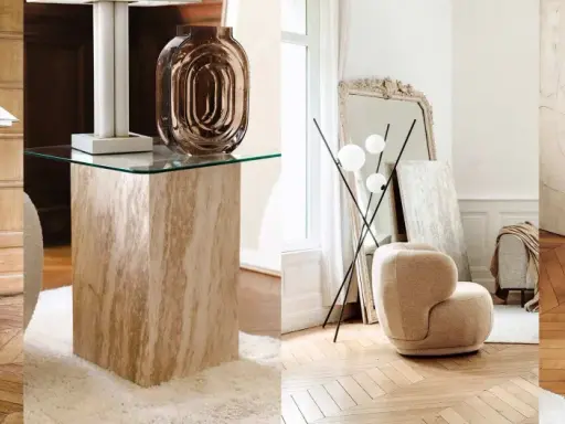 Arredamento vintage casa: poltrone soffici, tavolini in travertino e vetro, lampade di design e specchi antichi creano un'atmosfera accogliente.