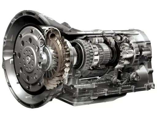 Przekrój automatycznej skrzyni biegów z widocznym sprzęgłem hydrokinetycznym, kołami zębatymi i elementami przeniesienia napędu.