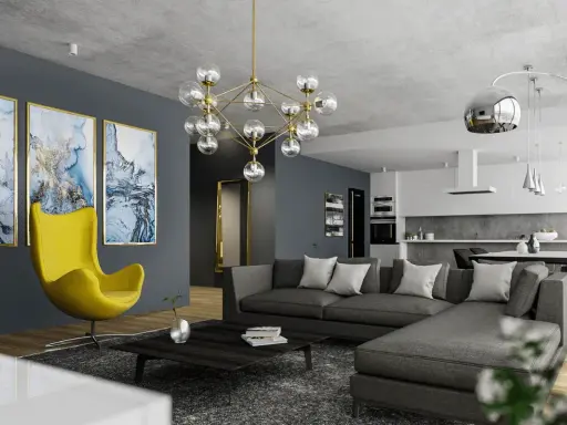 Nowoczesny salon z szarą kanapą i żółtym fotelem. Jak rozjaśnić ciemny pokój? Jasne obrazy i designerska lampa dodają światła.