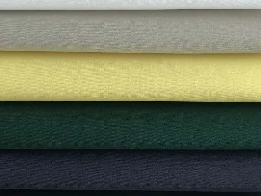 Stacked swatches of poplin fabric in white, light grey, yellow, dark green, and navy blue.
