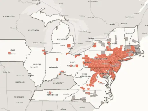 Map showing the spread of a spotted lanternfly infestation across the northeastern United States, with red areas indicating affected regions.
