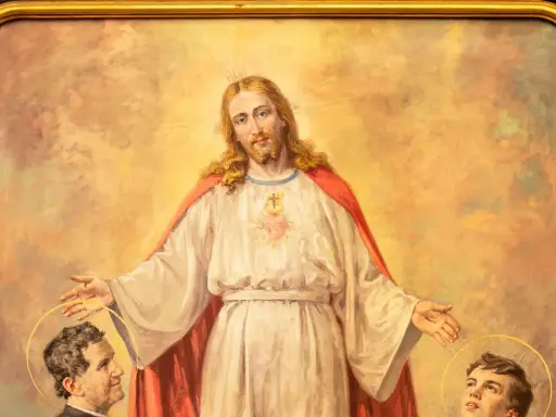 Jezus błogosławi młodego Dominika Savio i innego świętego.