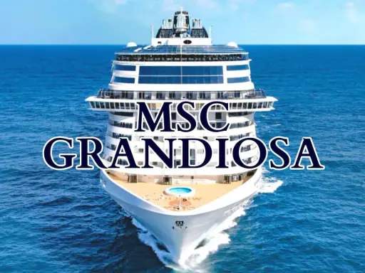La MSC Grandiosa solca il mare blu, un gigante bianco con ponti che promettono avventure.