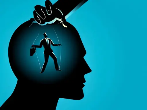 Silhouette di un uomo d'affari marionetta, mosso da fili da una mano, simboleggia la manipolazione mentale.